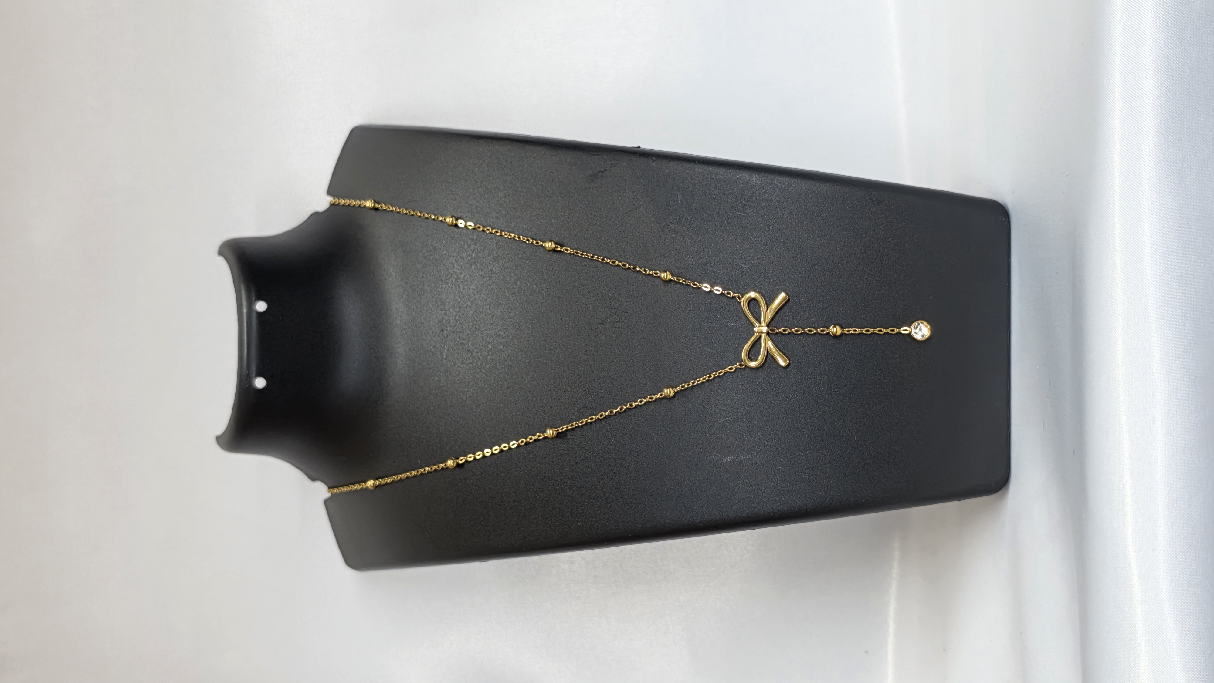 Gold Bow Drop Necklace — view 2